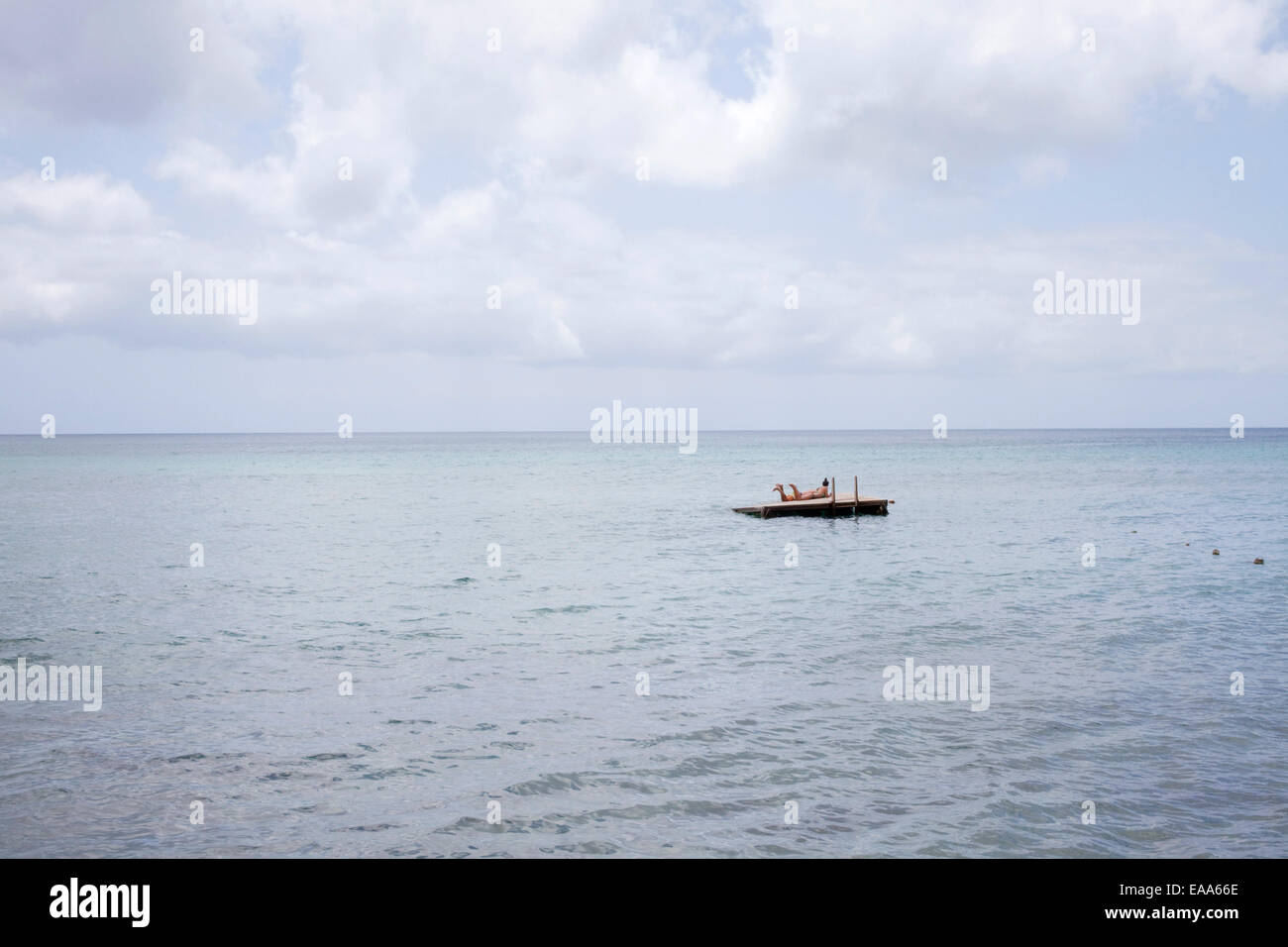 swimmers on raft in Caribbean Sea Stock Photo