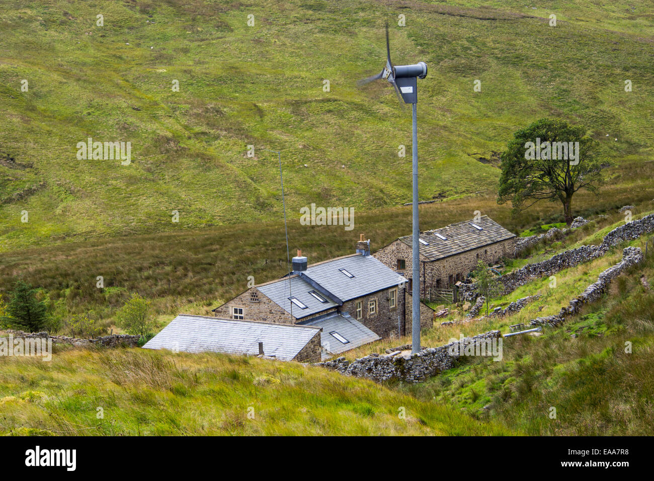 A remote off grid farmhouse at the head of Littondale with a wind turbine for power, Yorkshire Dales, UK. Stock Photo