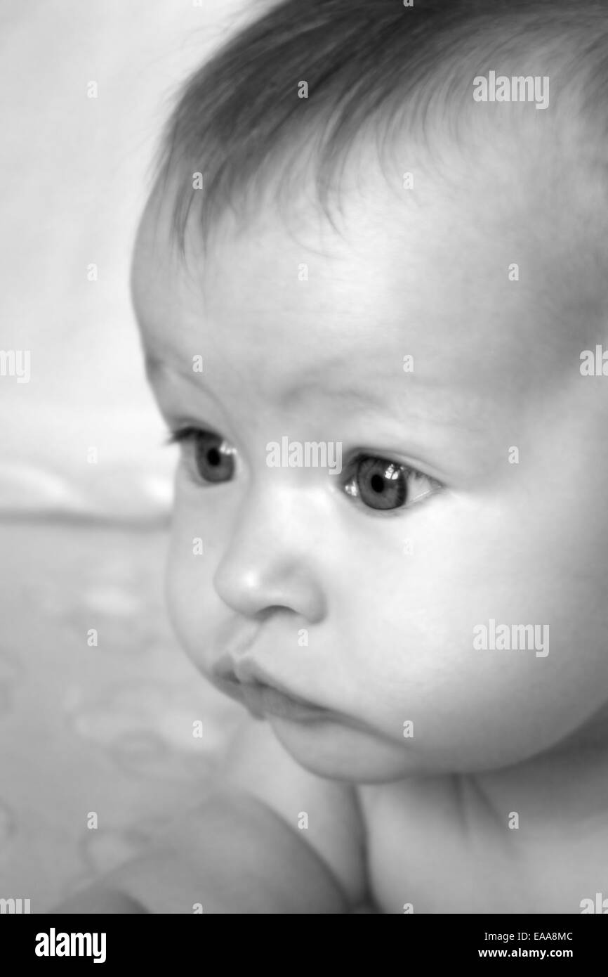 Little Baby Girl closeup on face in Black and White Stock Photo