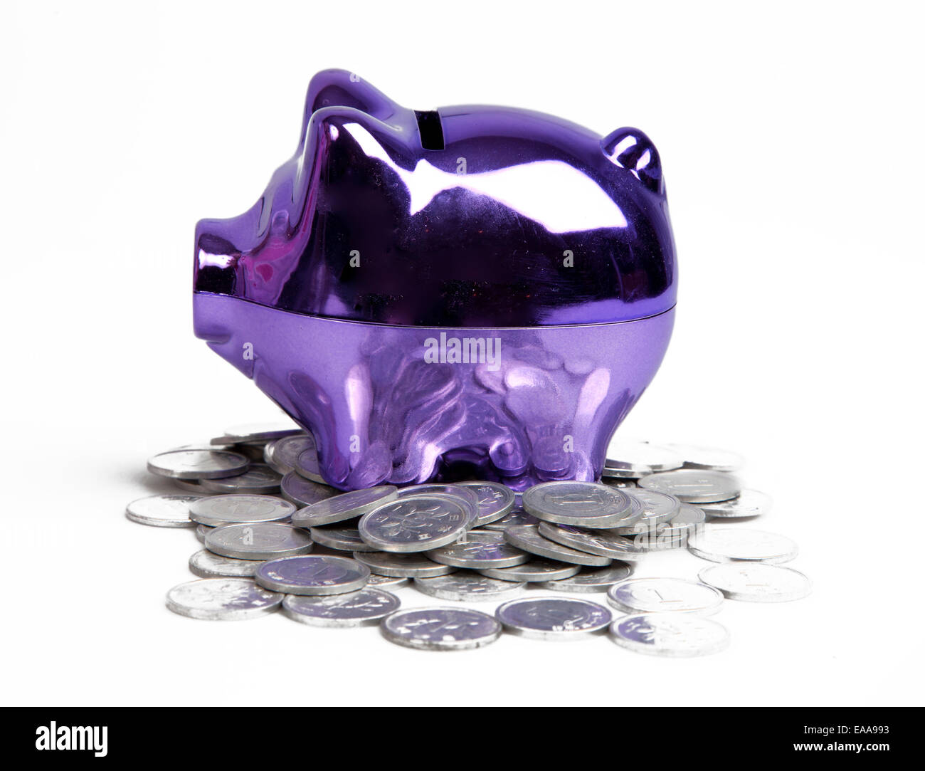 Purple piggy bank on white background Stock Photo - Alamy
