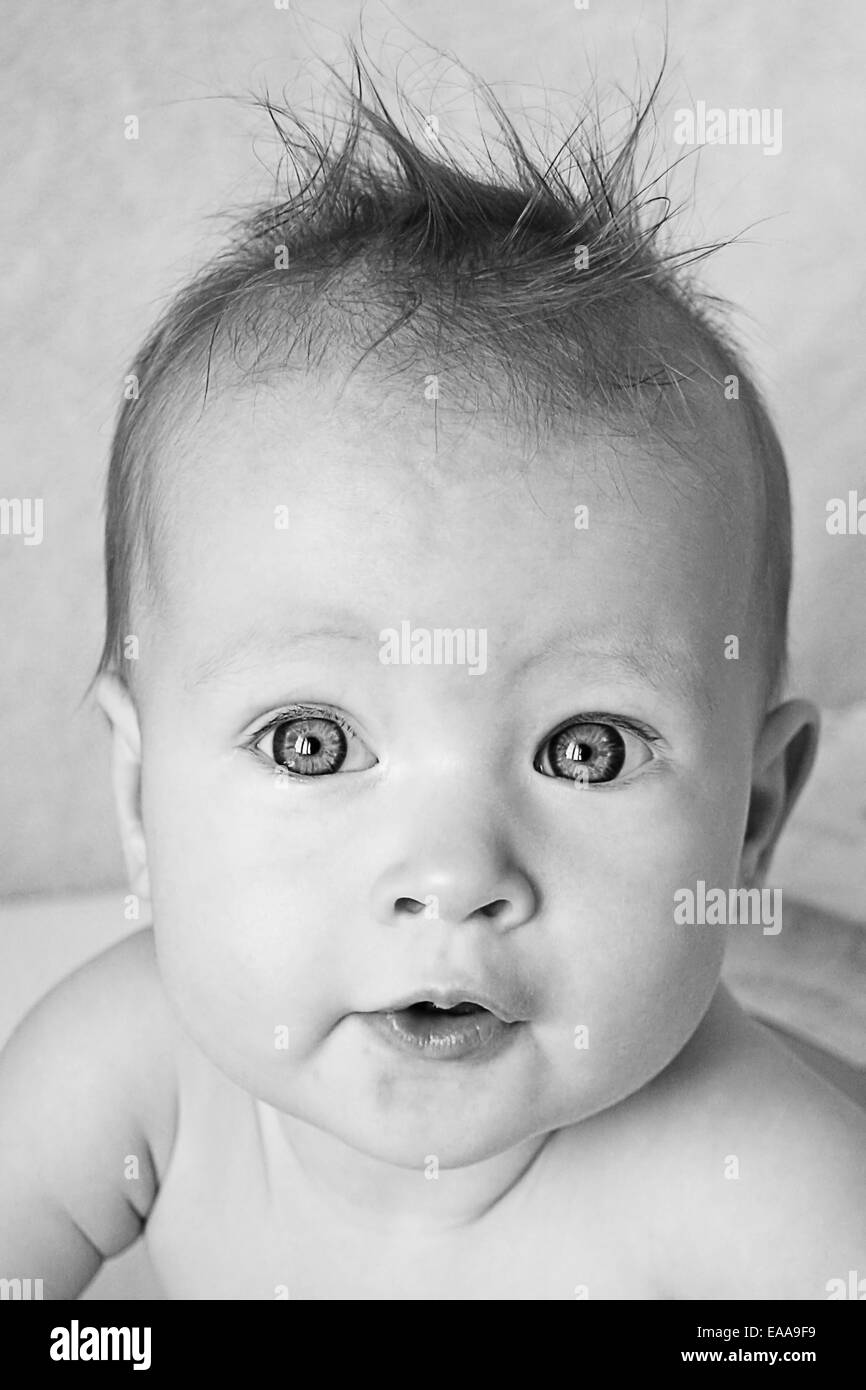 Little Baby Girl with hair stuck up taken closeup - black and white Stock Photo