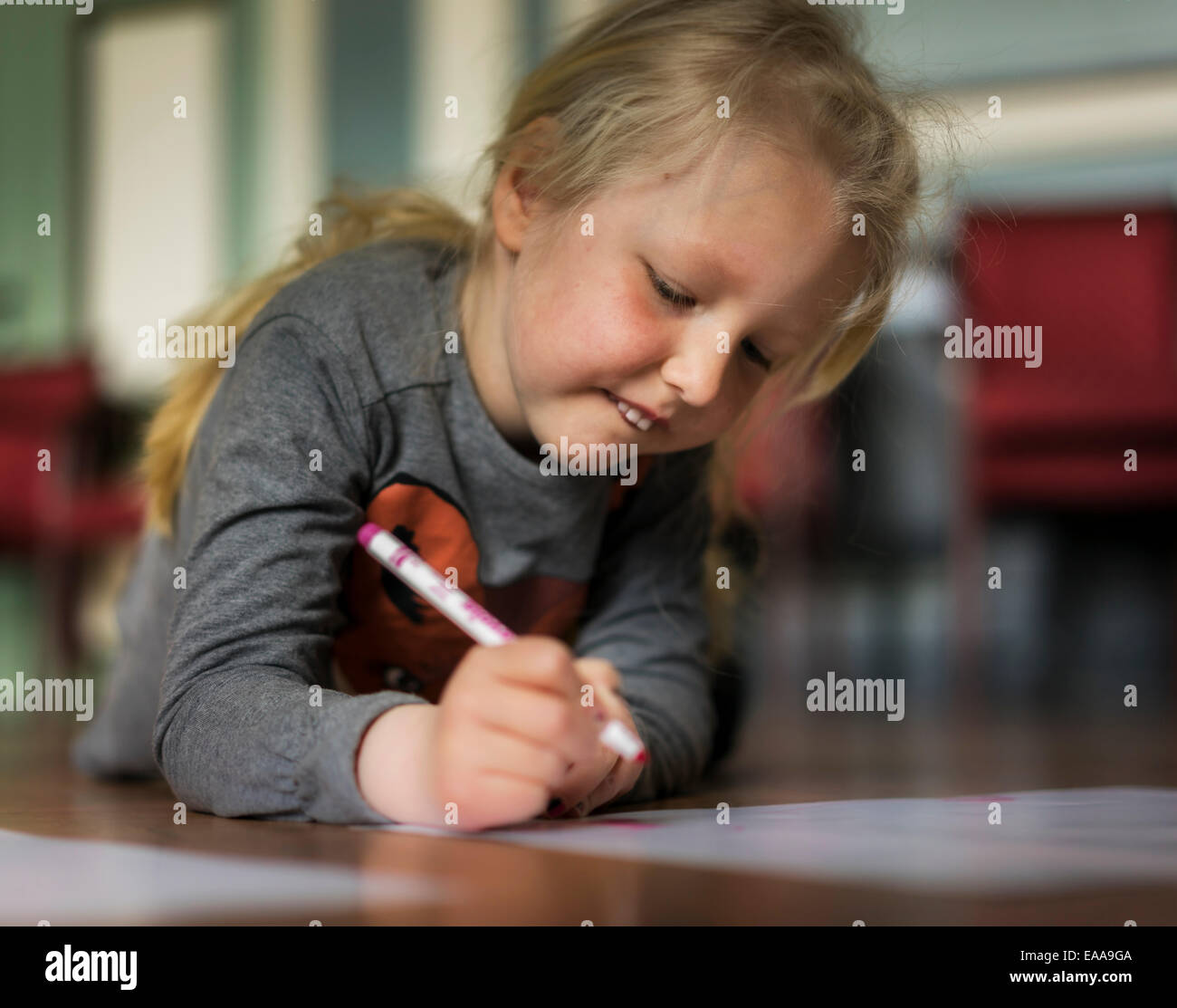 Young girl drawing, Reykjavik, Iceland Stock Photo