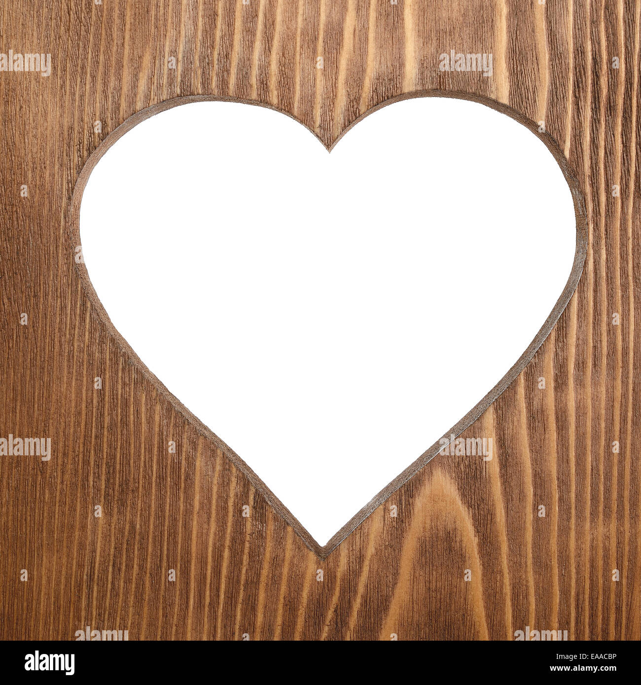 Heart carved in old wood Stock Photo