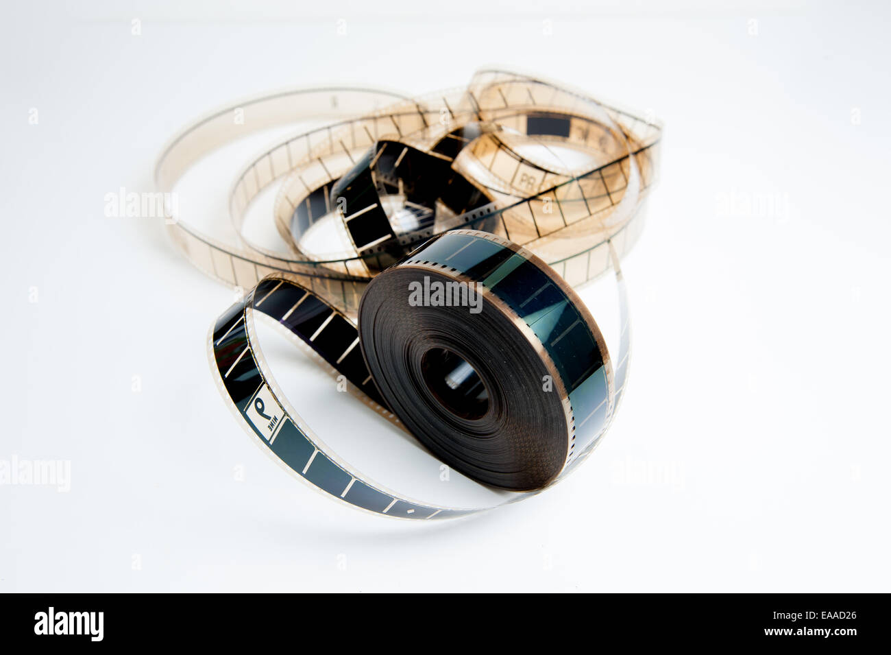 Unrolled movie film reel on white background Stock Photo - Alamy