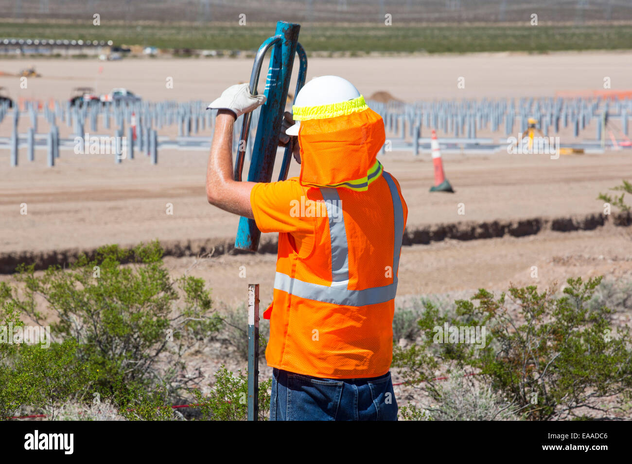 Construction workers building the Copper Mountain Solar 3 project, is a 250-megawatt solar power plant that produces enough energy to power 80, 000 homes, in Nevada, USA. Stock Photo