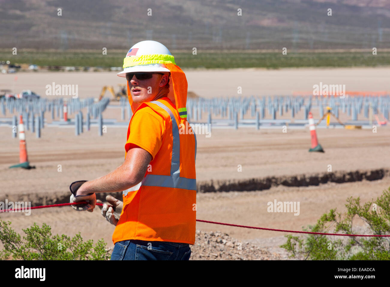 Construction workers building the Copper Mountain Solar 3 project, is a 250-megawatt solar power plant that produces enough energy to power 80, 000 homes, in Nevada, USA. Stock Photo