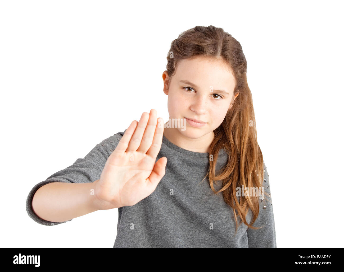 young girl making stop gesture on white background Stock Photo