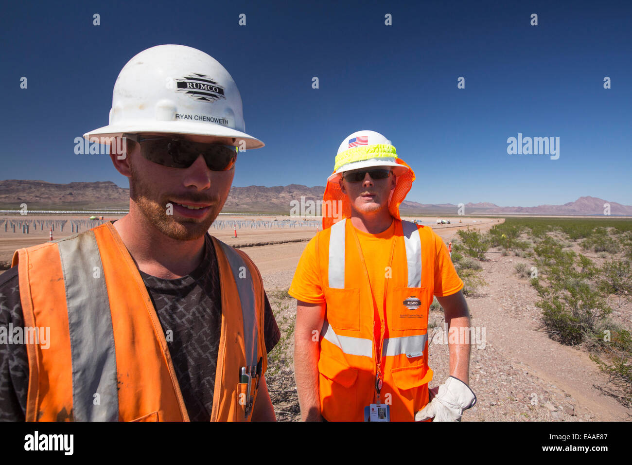 Construction workers, working on the Copper Mountain Solar 3 project, is a 250-megawatt solar power plant that produces enough energy to power 80, 000 homes, in Nevada, USA. Stock Photo