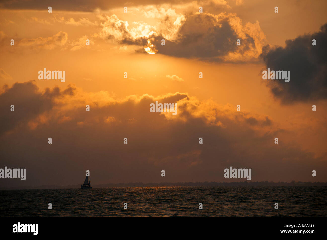 sunset [warm light] seascape cloud Florida boat Stock Photo