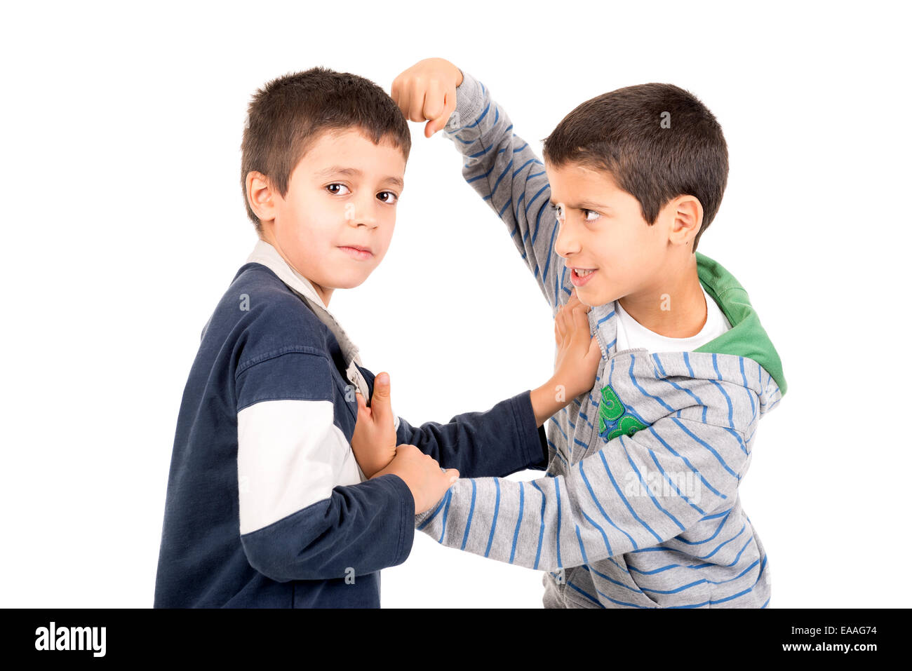 Young boys fighting isolated in white Stock Photo