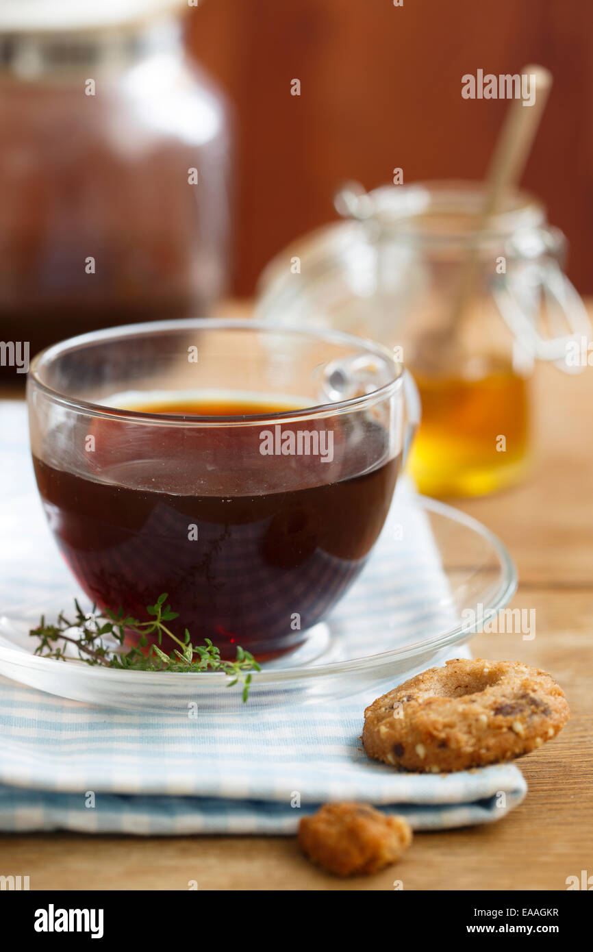 Black tea with honey and herbs Stock Photo Alamy