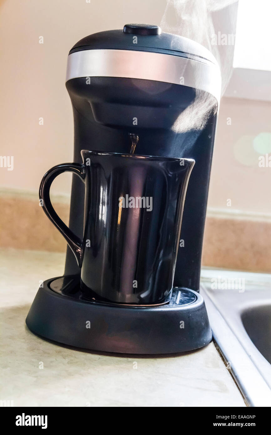 Steam rising from a single cup coffee maker Stock Photo Alamy