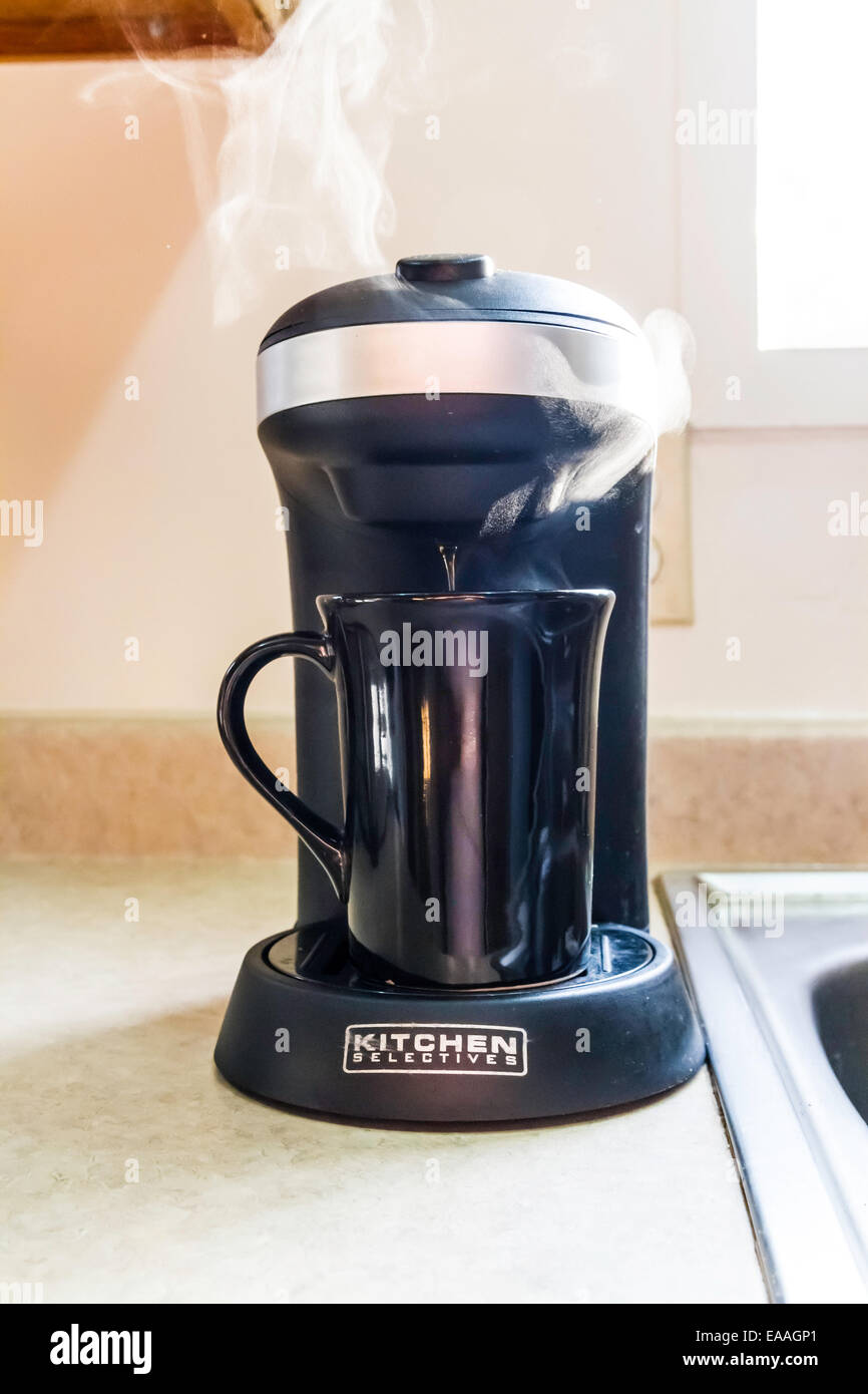 Steam rising from a single cup coffee maker Stock Photo Alamy