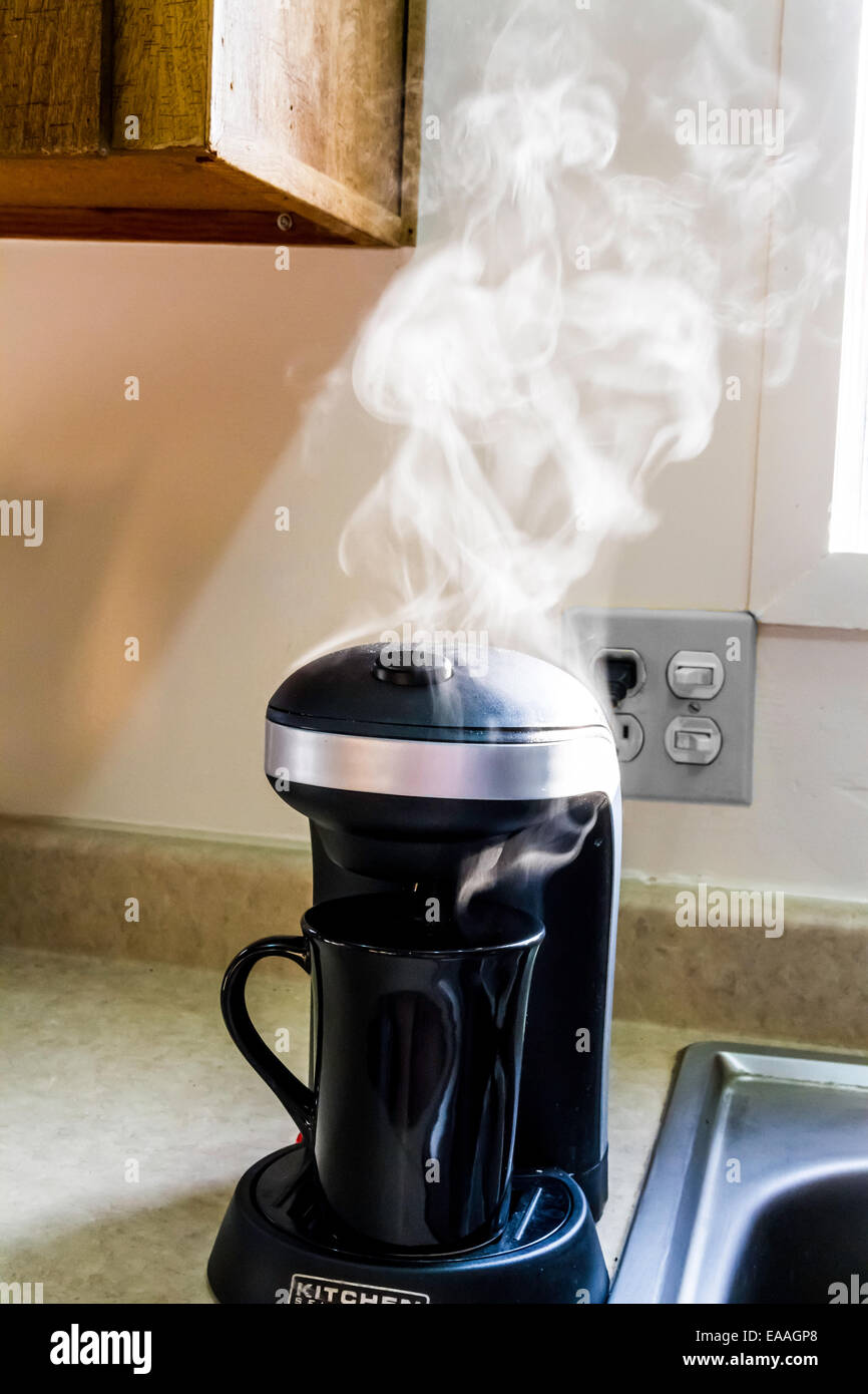 Steam rising from a single cup coffee maker Stock Photo Alamy