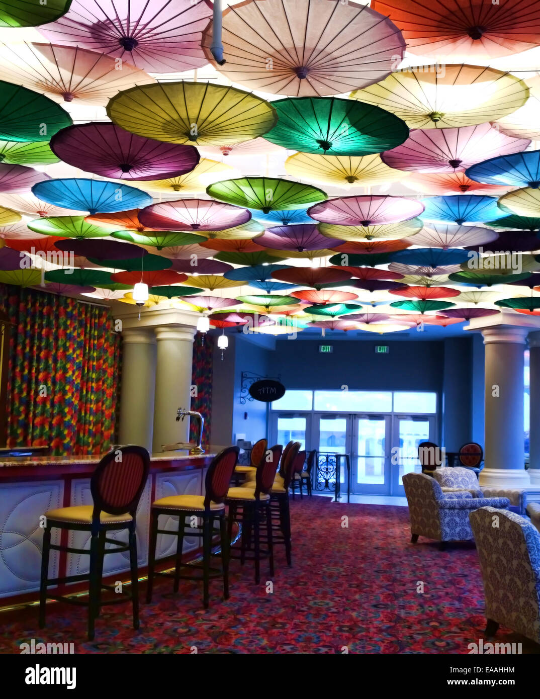 upscale cocktail lounge and bar with umbrella decorations Stock Photo