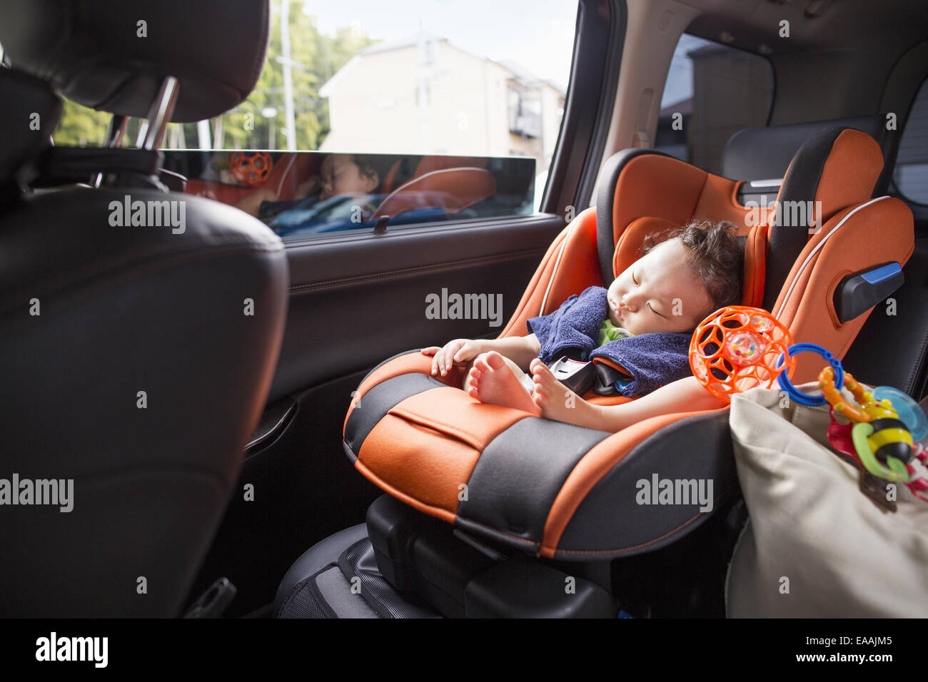 A mother and her young baby boy in a car. Stock Photo