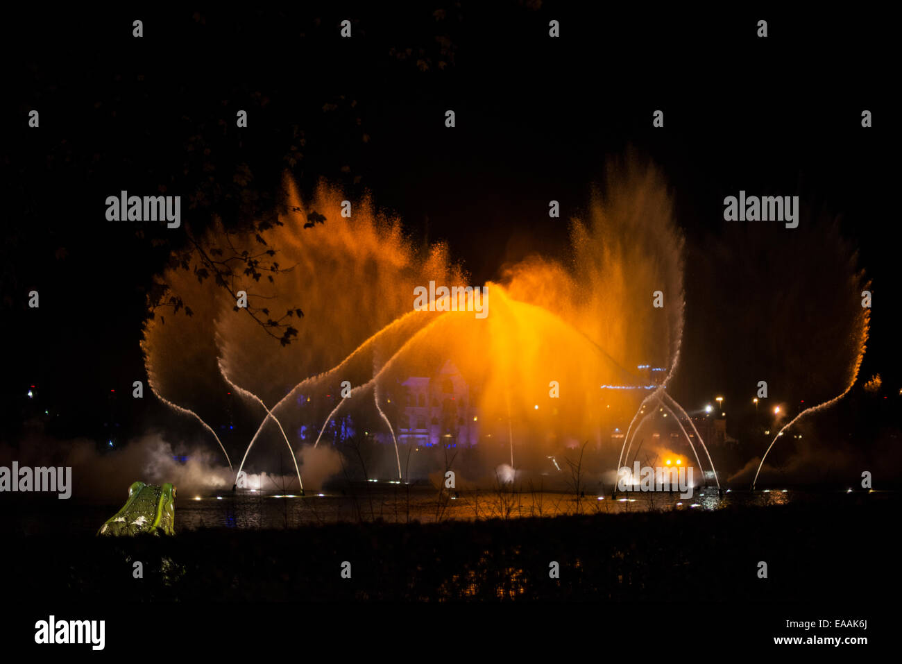 magic water fountain in gold and yellow colors during music show in holland Stock Photo