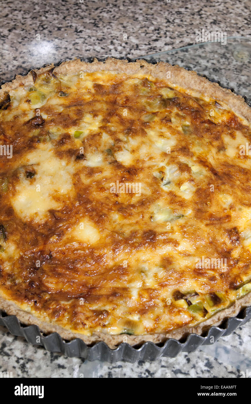Making a leek and cheese flan from leeks grown organically in the garden sequence. Step 9 Finished product Stock Photo
