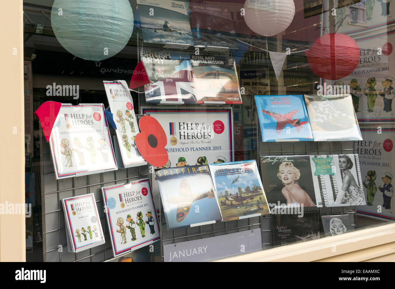 Help for Heroes and military themed calendars and year planners displayed in UK shop window Stock Photo