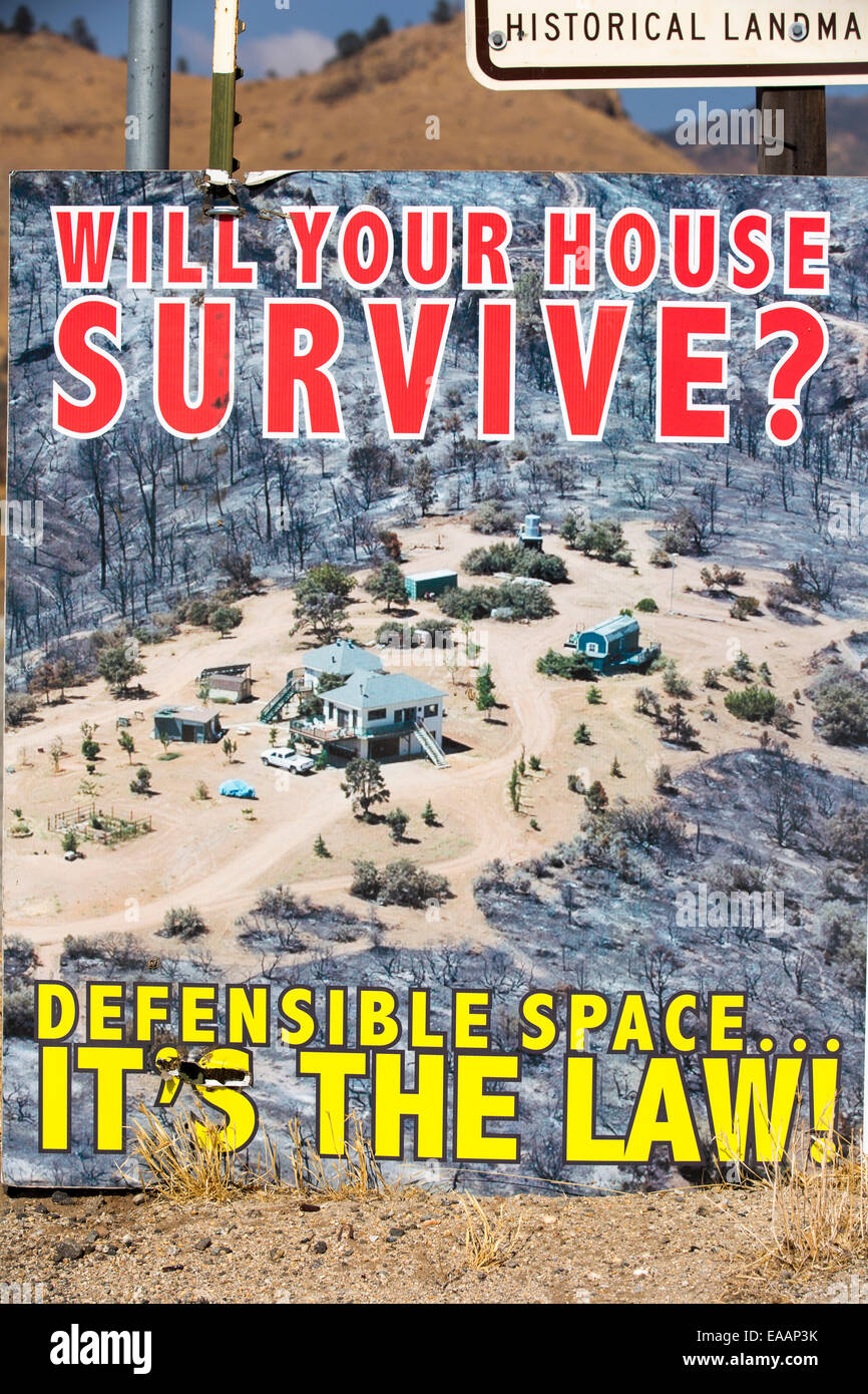 A poster about defensible space around your house, in a drought parched area of Kern County, California, USA. Stock Photo