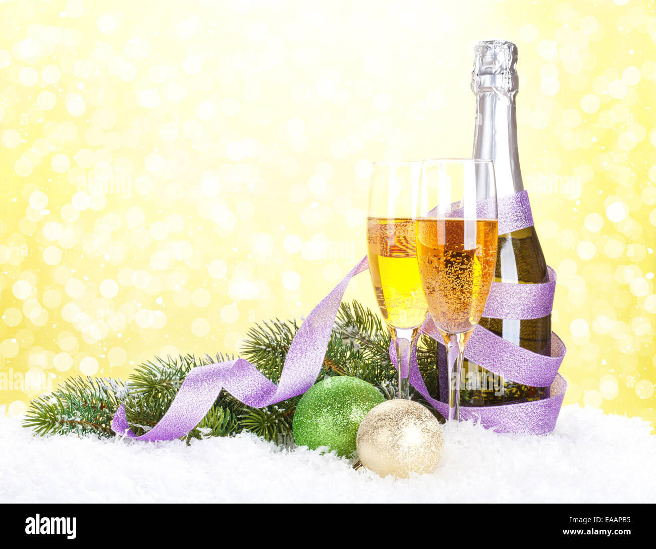 Champagne and christmas decor with snow bokeh background Stock Photo
