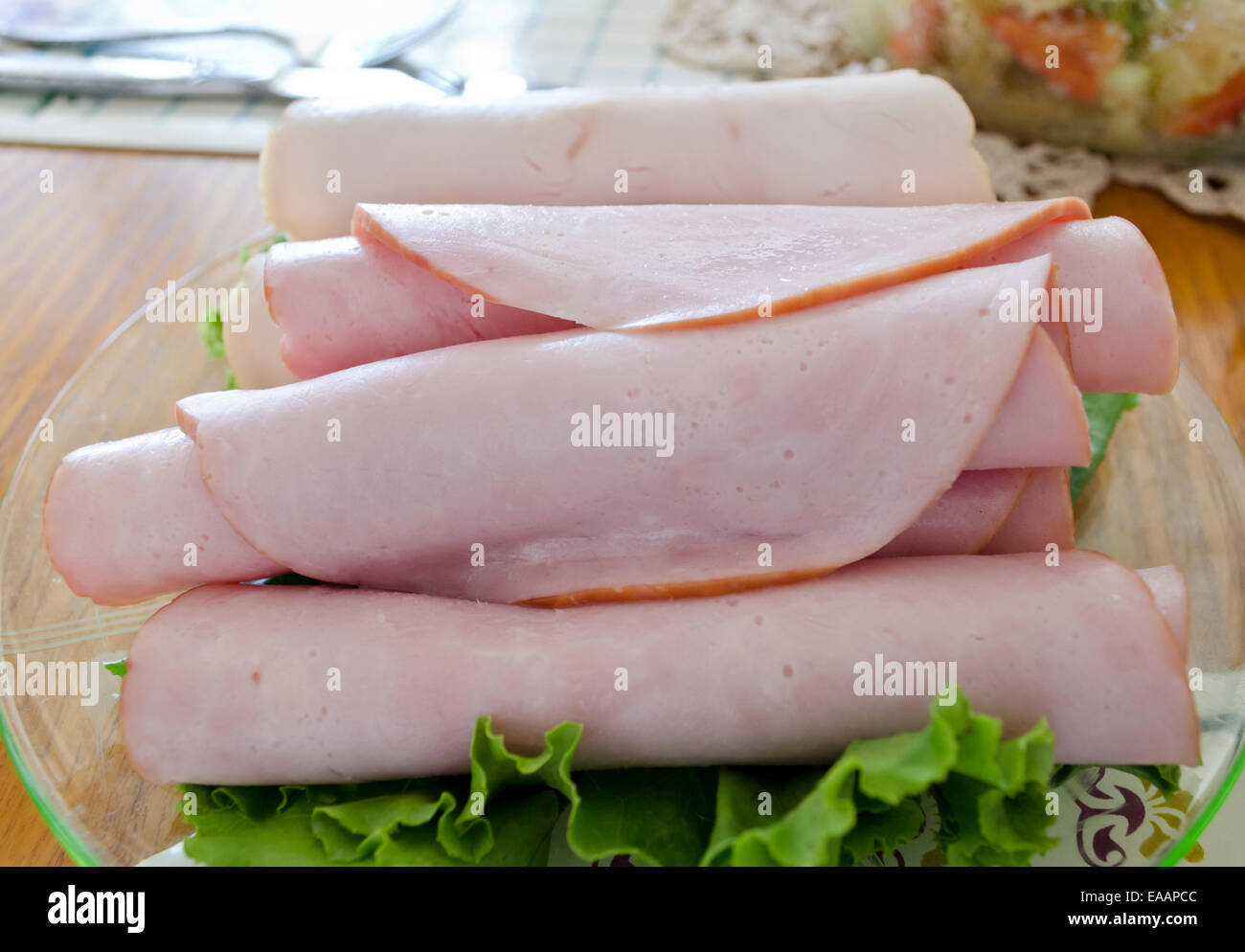 Rolled deli meat on a plate. Rolled sandwich or luncheon meat Stock