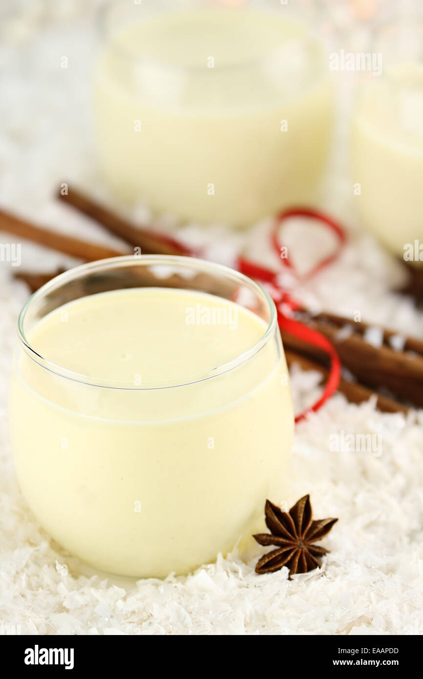 Fresh eggnog with cinnamon sticks and star of anise ready for the Christmas season. Extreme shallow depth of field. Stock Photo