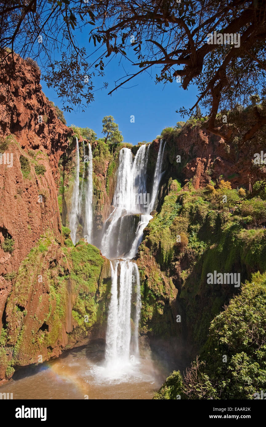 Vertical view of water spilling over Cascades d'Ouzoud on a sunny day. Stock Photo