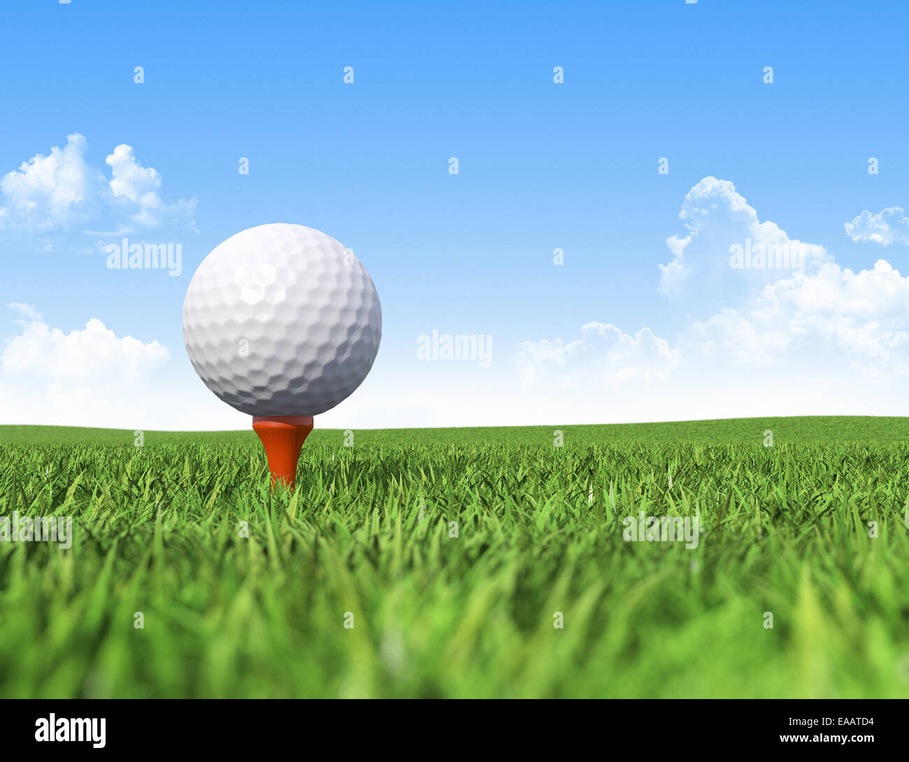 Golf ball on tee in grass Stock Photo