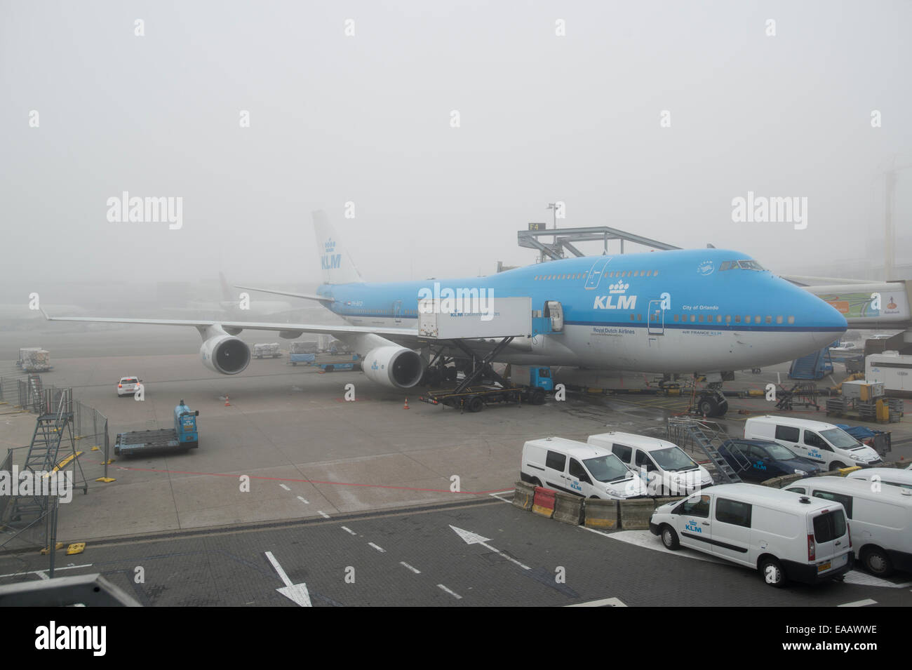 Fog delays a KLM Boeing 747 airliner from taking off at Amsterdam Schiphol Airport (Editorial use only). Stock Photo