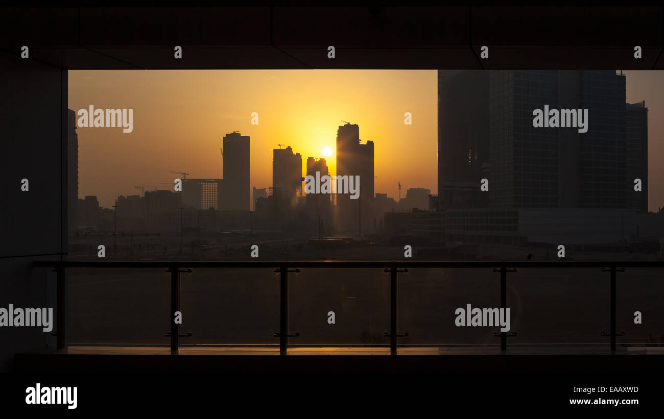 Silhouette of Dubai skyline at the sunrise. Stock Photo