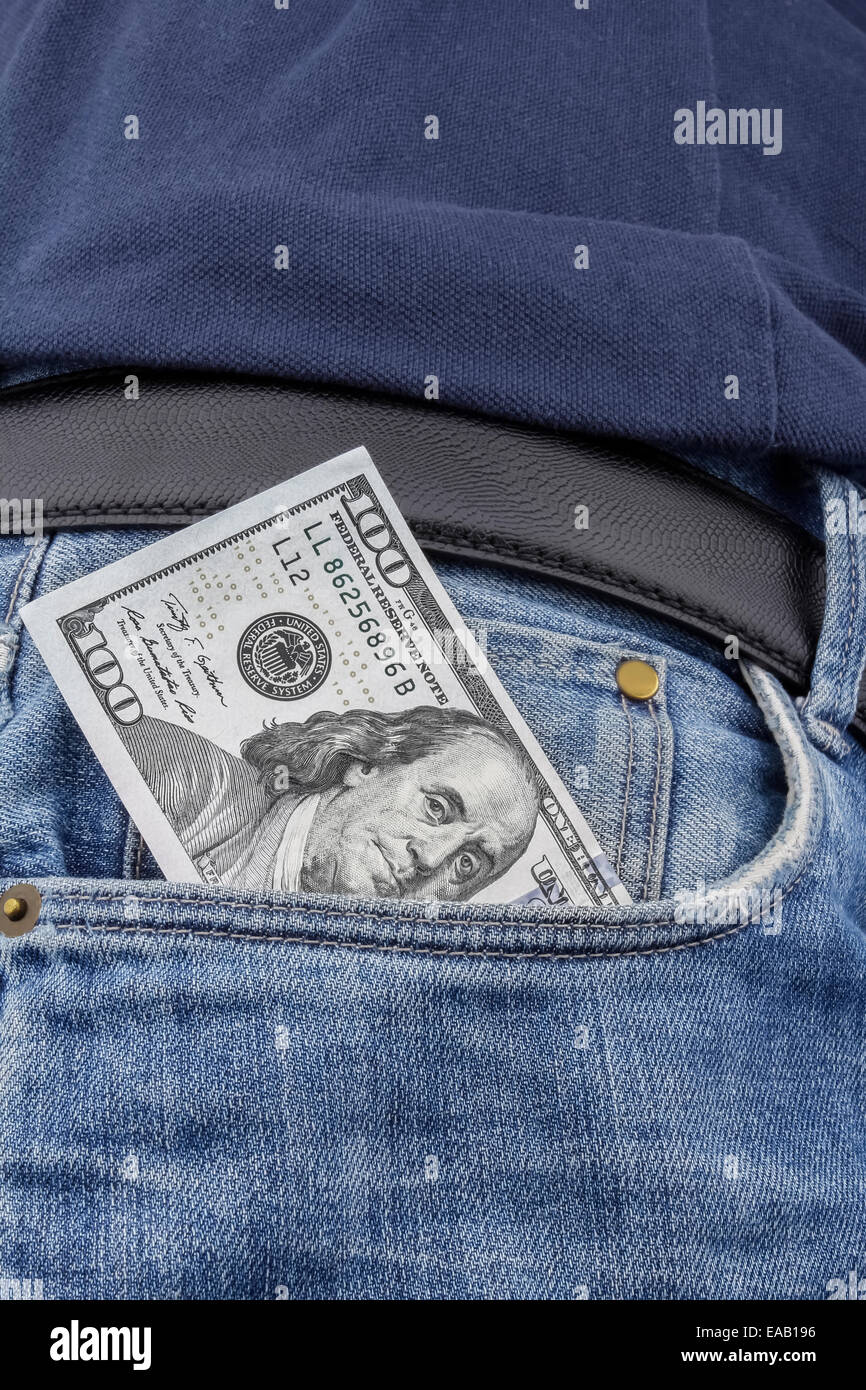 US Dollar note in the front pocket of a pair of  blue jeans. (100 USD note) Stock Photo