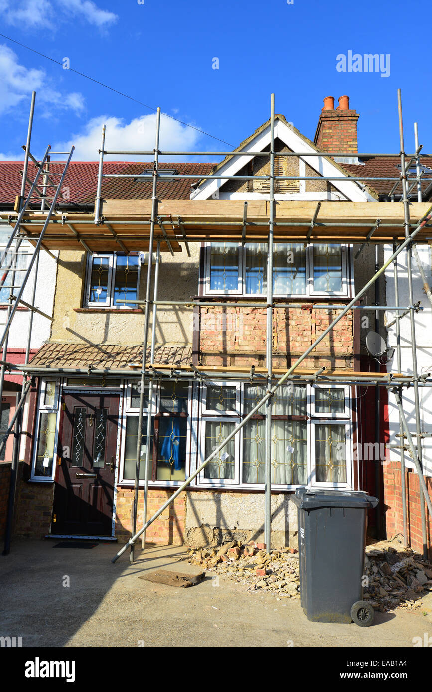 Terraced house covered in scaffolding, Norwood Road, Southall, London Borough of Ealing, Greater London, England, United Kingdom Stock Photo