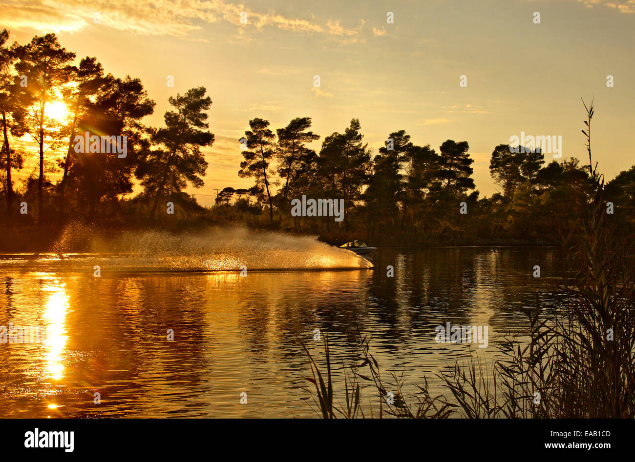 Water skiing around sunset in Kaiafas lake, municipality of Zacharo