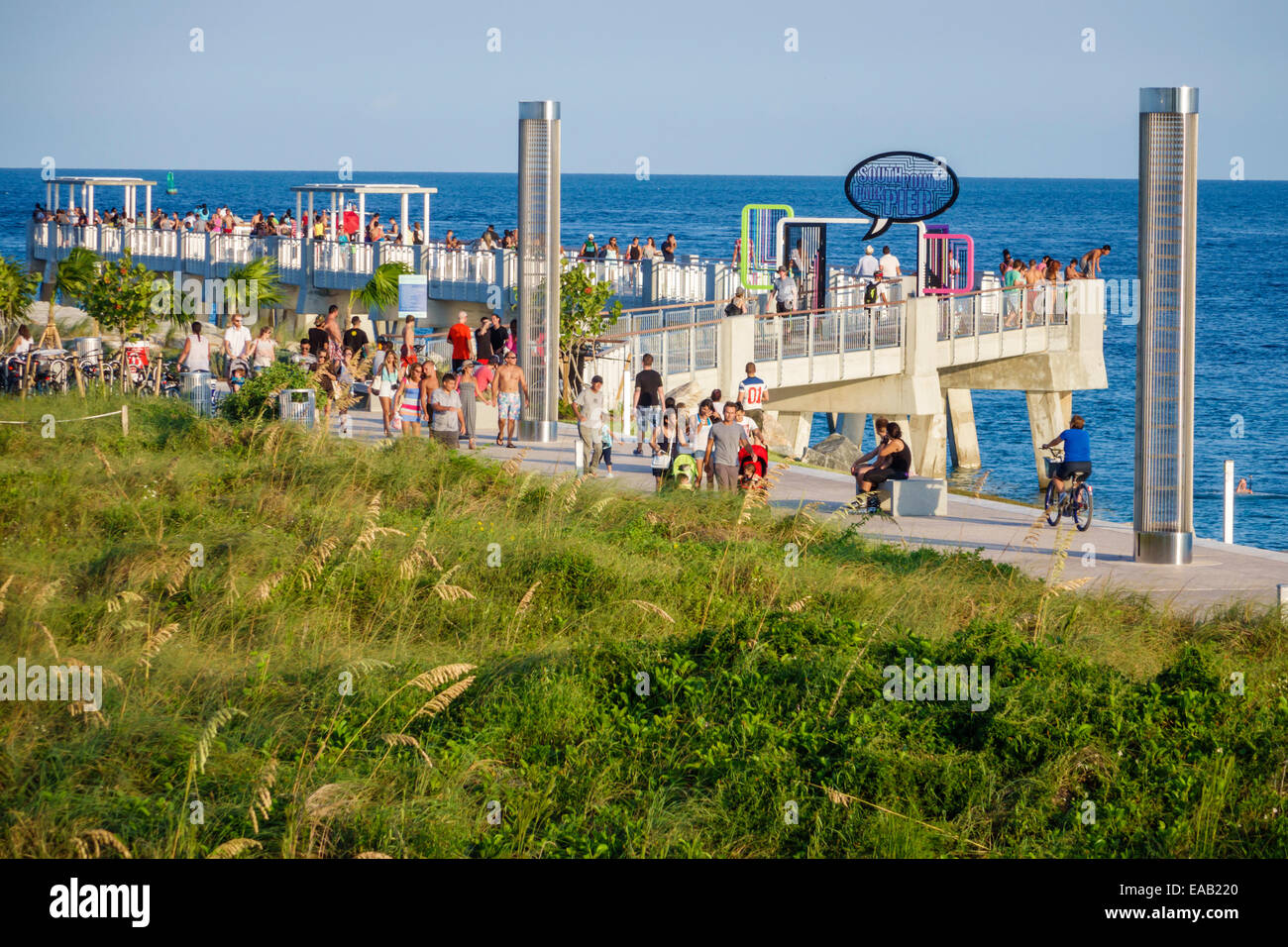 Miami Beach Florida,South Pointe Park Pier,Atlantic Ocean,water,dune grass,natural,turtle light towers,FL140823034 Stock Photo