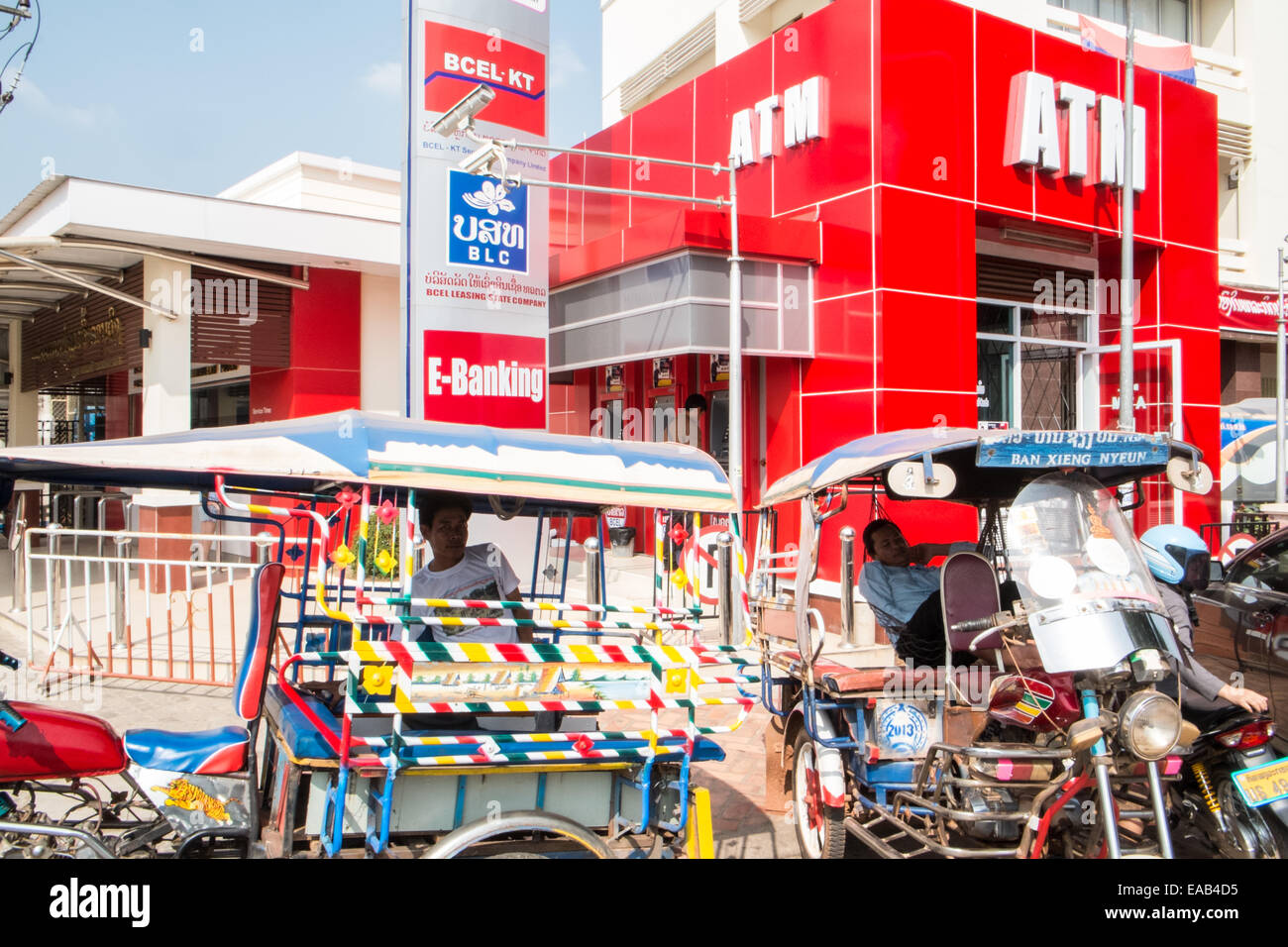 https www alamy com stock photo tuk tukvehiclesmotorbikeslocal taxi and new atm bank cash machine 75233009 html