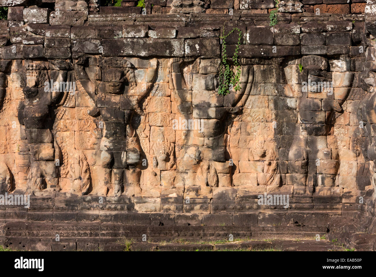 Cambodia, Angkor Thom.  Garuda Figures Holding up the Walkway adjacent to the Elephant Terrace. Stock Photo