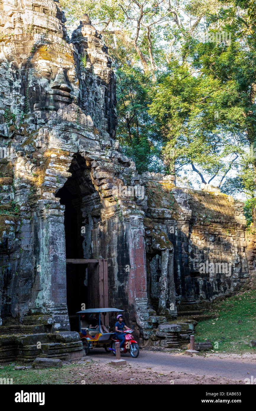 Cambodia.  North Gate, Angkor Thom, with Motorized Rickshaw Taxi. Stock Photo