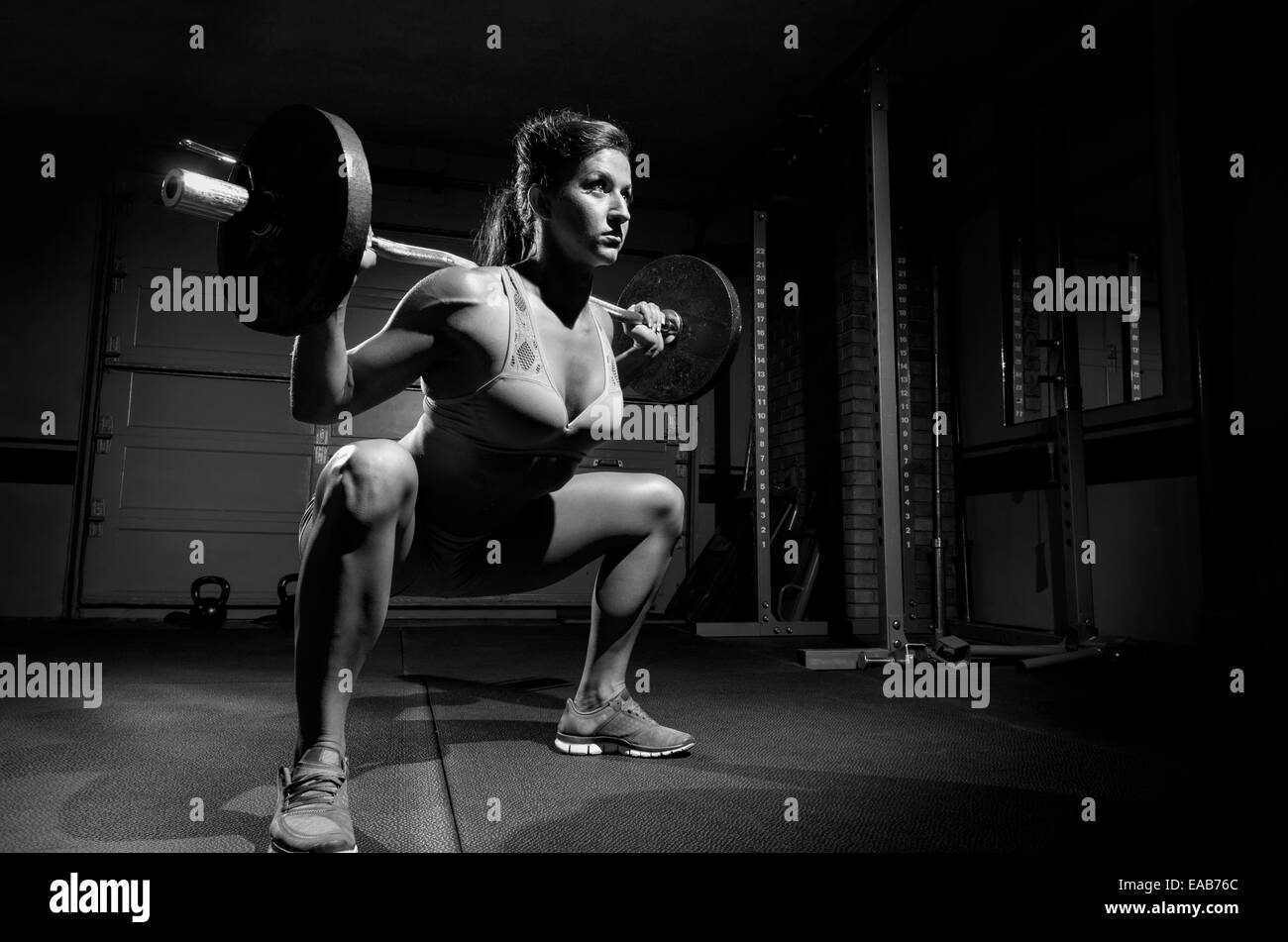 This is a woman working out in black and white. Stock Photo