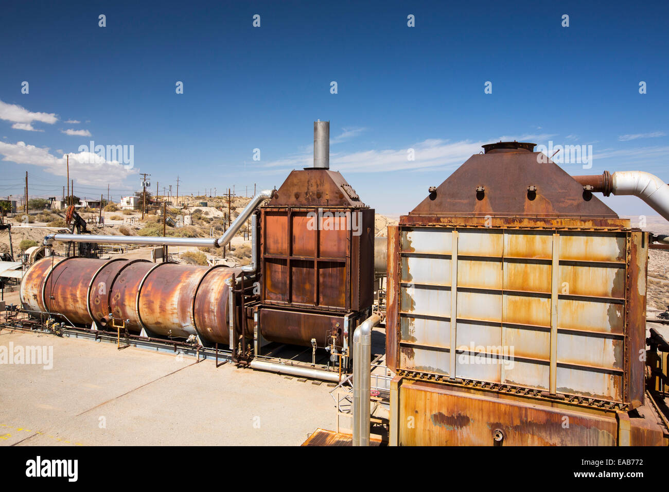 Steam equipment in the Midway Sunset oilfield near Taft, Bakersfield, California, USA. Following an unprecedented four year long Stock Photo