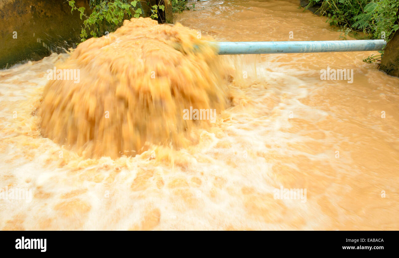 The Stream of Dirty Water from Pipeline. Stock Photo