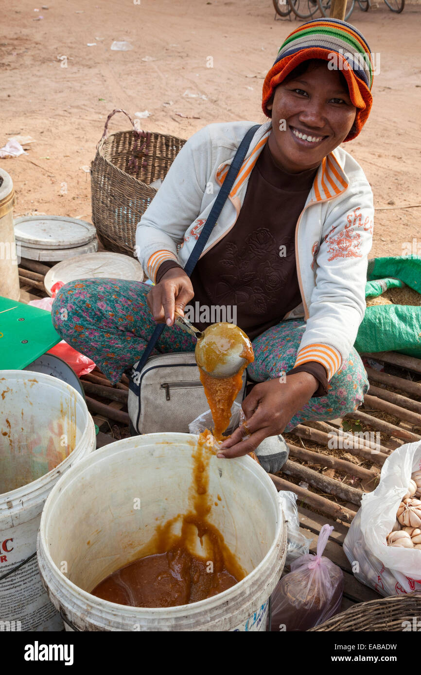 Cambodia.  Woman Selling Cooking Ingredients in Plastic Bag, Market near Siem Reap. Stock Photo