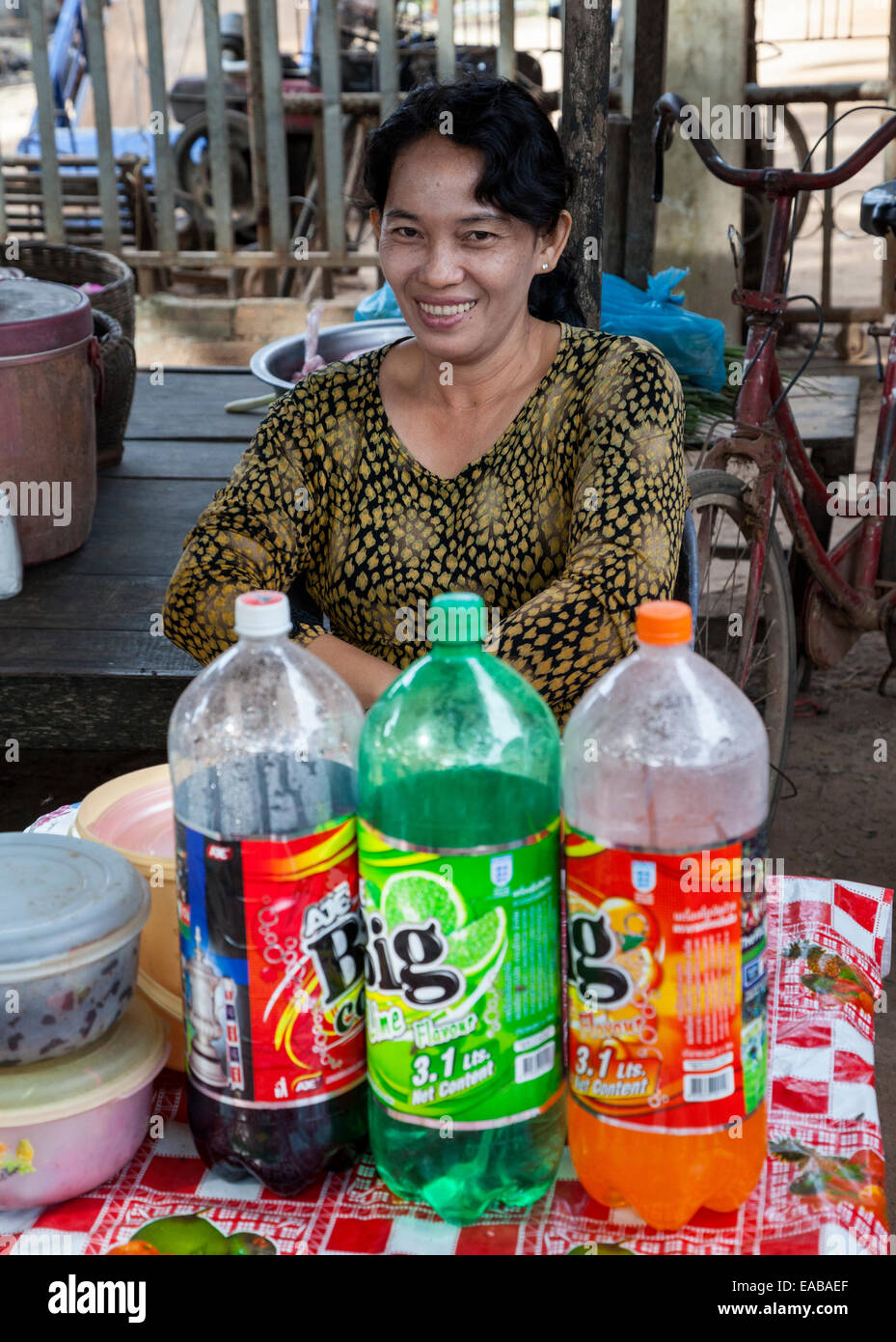 Cambodia.  Market near Siem Reap.  Woman Selling Soft Drinks. Stock Photo
