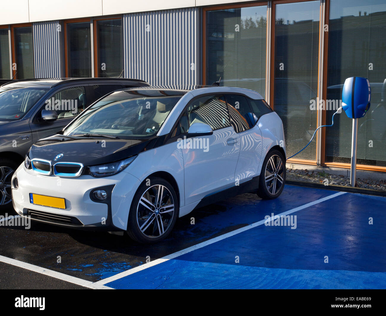 BMW i3 electric car parked at charging station in Breda, the Netherlands Stock Photo