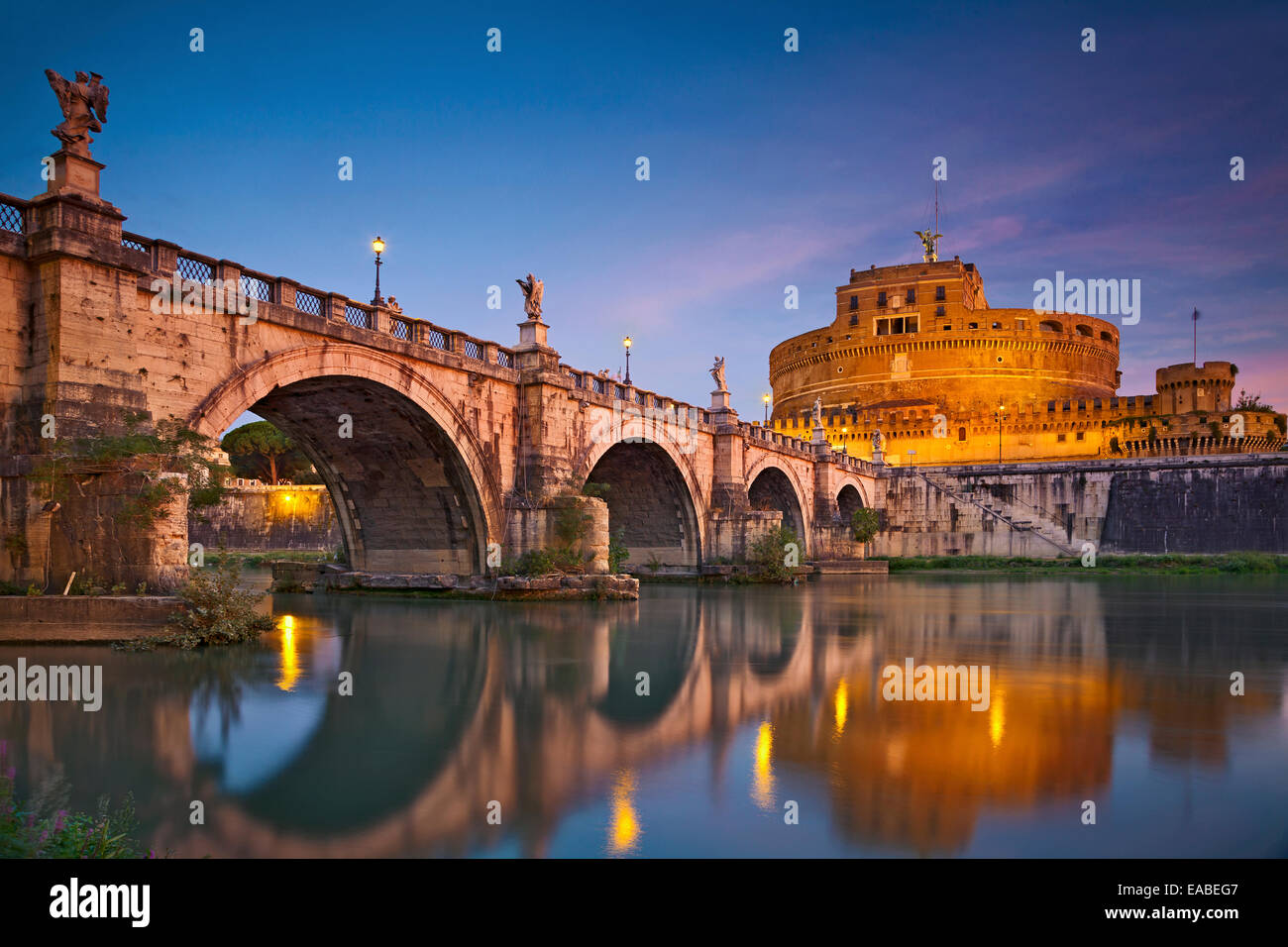 Rome.  Image of the Castle of Holy Angel and Holy Angel Bridge over the Tiber River in Rome at sunrise. Stock Photo