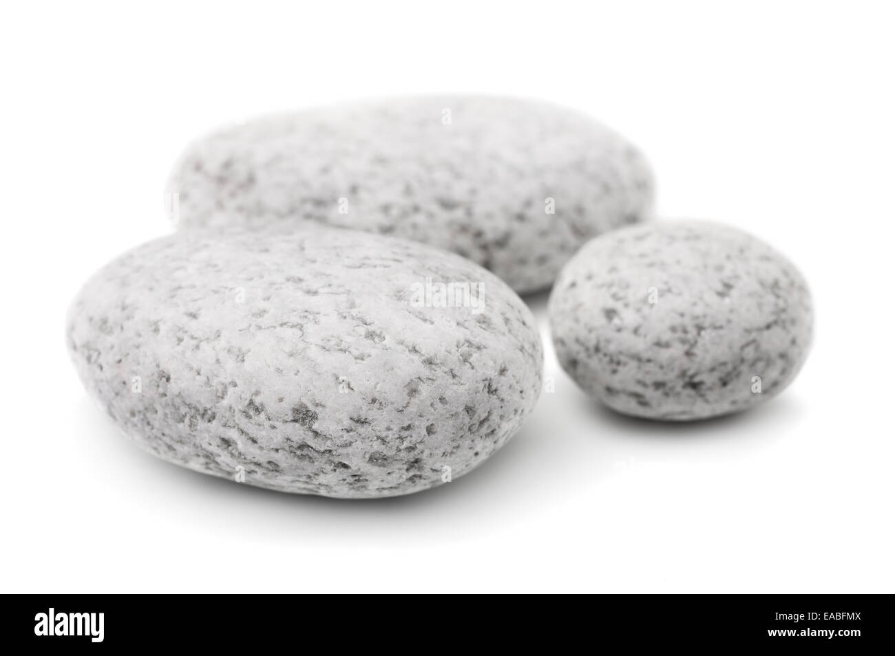 Three white pebbles isolated on white Stock Photo