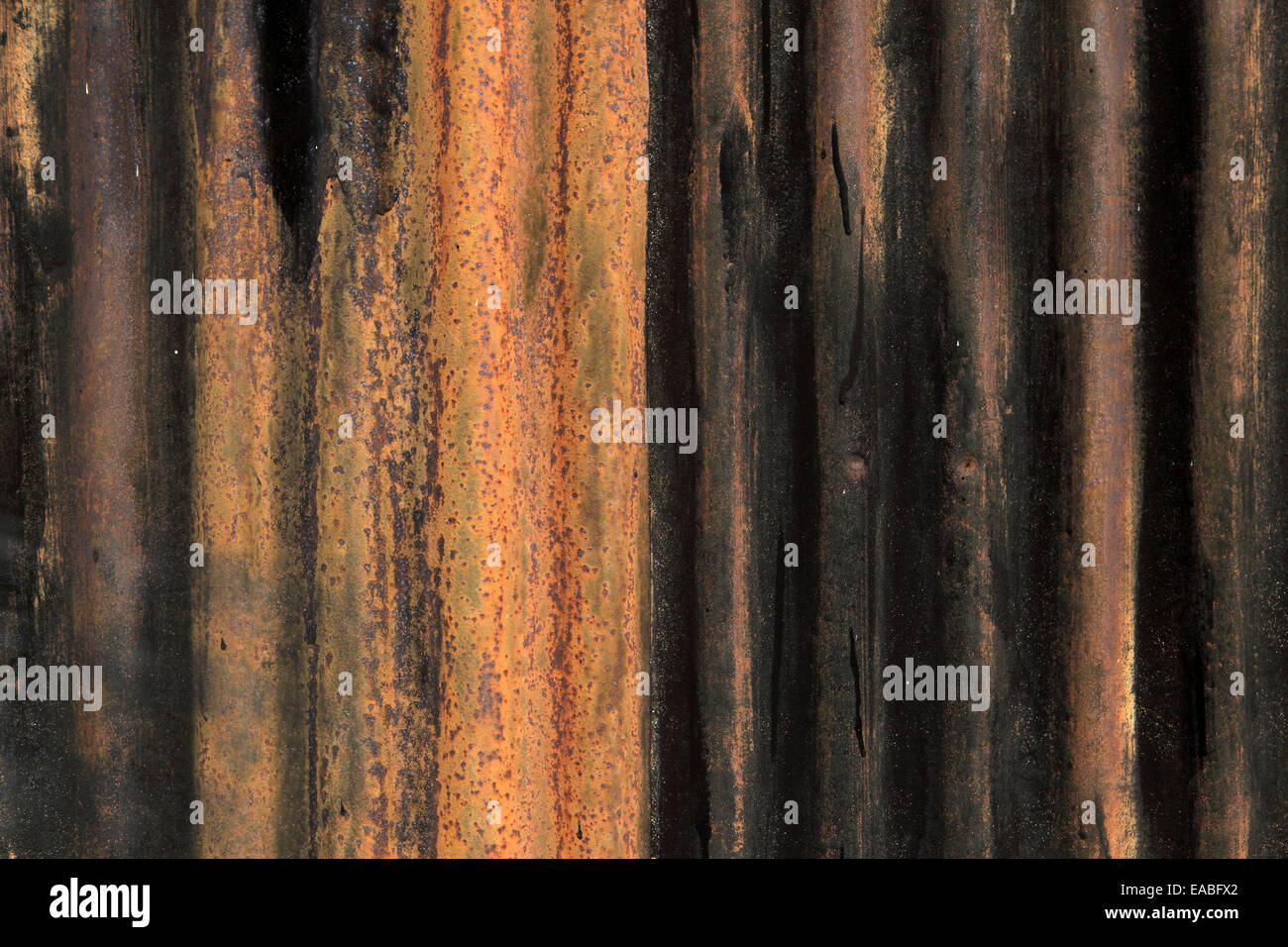 Corroded, rusted corrugated iron metal, suitable for background. Stock Photo