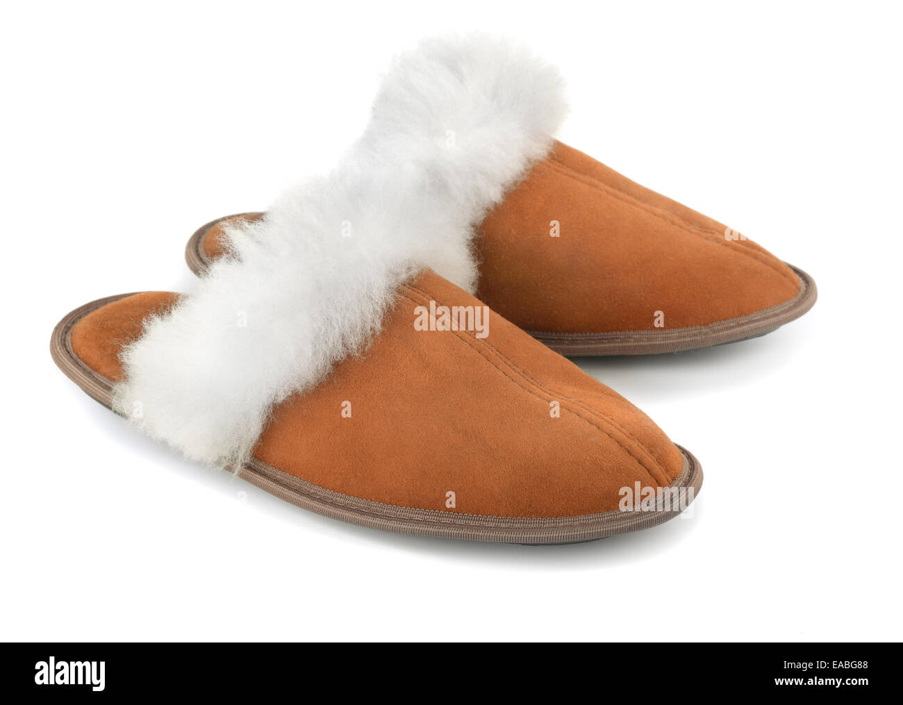 Brown sheepskin suede slippers isolated on white Stock Photo
