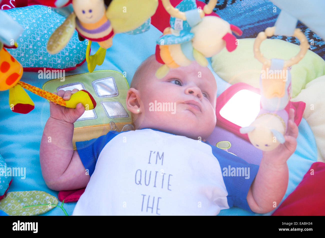 Baby Playing On Mat With Gym Mobile Above Stock Photo 75242920