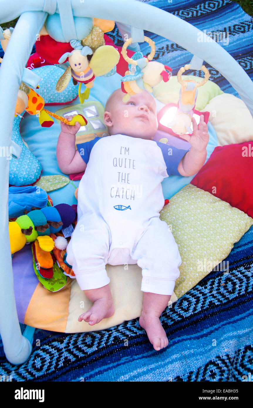 Baby Playing On Mat With Gym Mobile Above Stock Photo 75242921